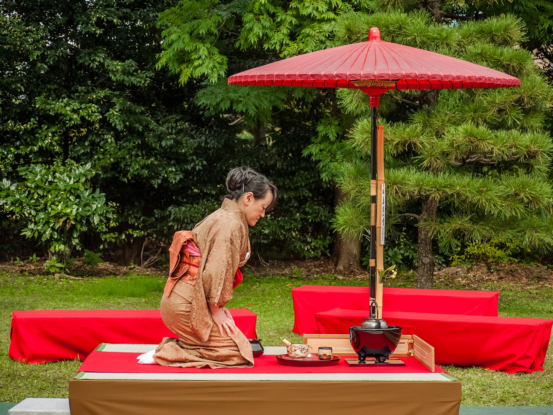 A traditional tea ceremony setting with a ceramic teapot and cups
